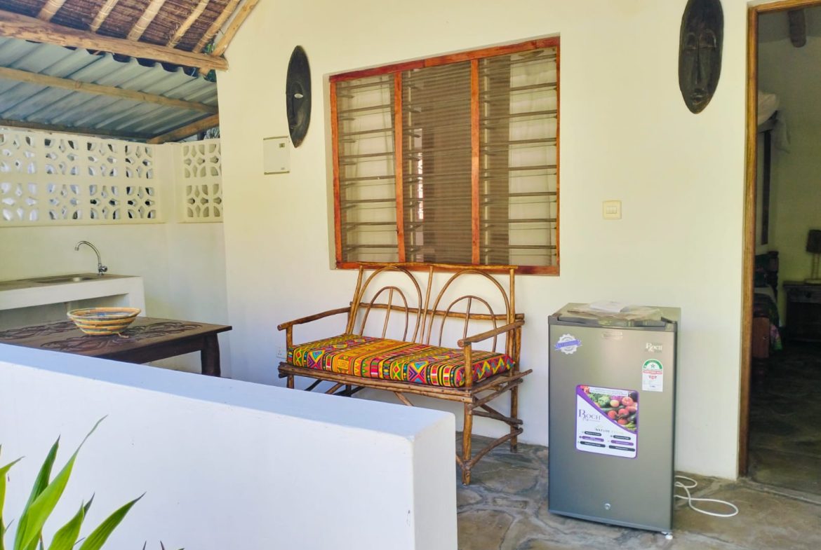 For sale: Three solar-powered bungalows in Watamu, just 15 minutes from the beach. Each en-suite one-bedroom chalet features stylish furnishings, a kitchenette, and shares a lush garden with a gazebo. Secure parking for three cars and priced at 13.5M ONO, offering excellent investment potential.