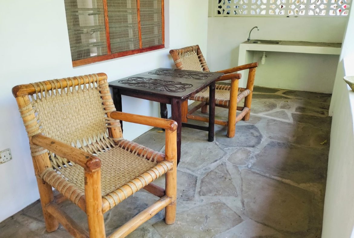 For sale: Three solar-powered bungalows in Watamu, just 15 minutes from the beach. Each en-suite one-bedroom chalet features stylish furnishings, a kitchenette, and shares a lush garden with a gazebo. Secure parking for three cars and priced at 13.5M ONO, offering excellent investment potential.