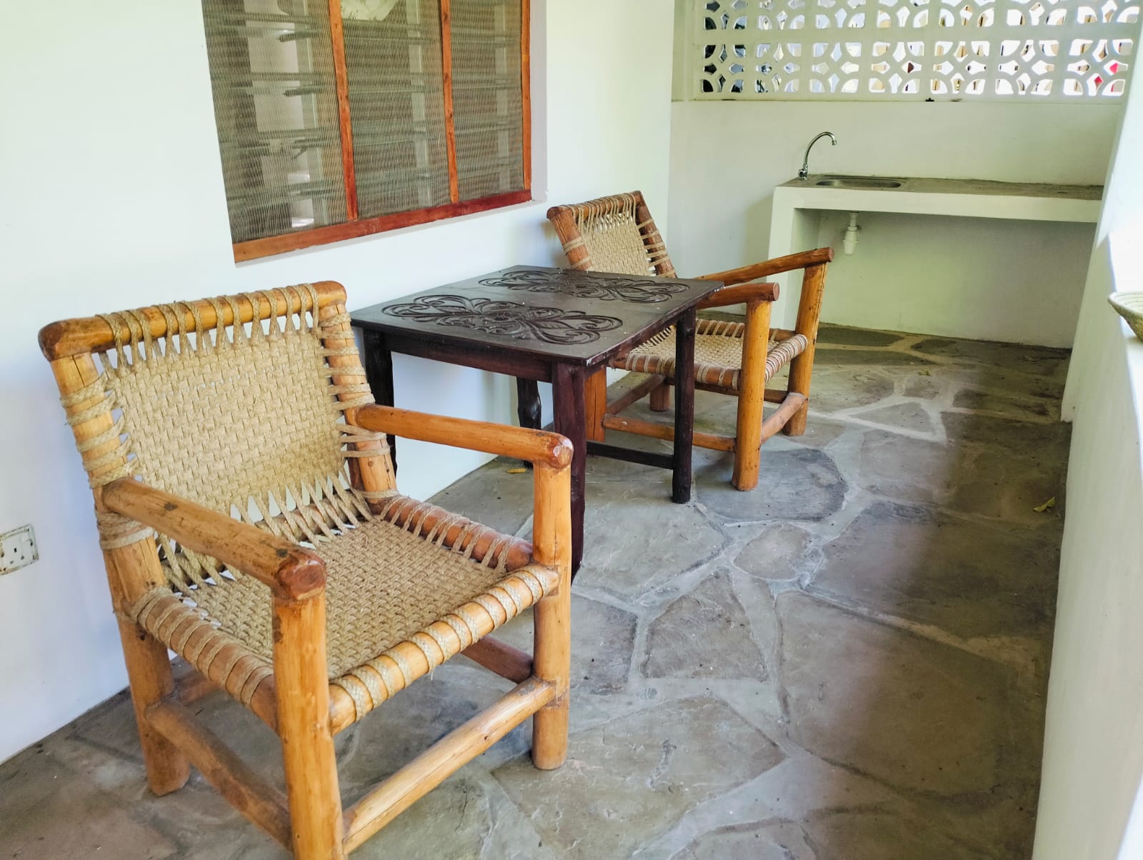 For sale: Three solar-powered bungalows in Watamu, just 15 minutes from the beach. Each en-suite one-bedroom chalet features stylish furnishings, a kitchenette, and shares a lush garden with a gazebo. Secure parking for three cars and priced at 13.5M ONO, offering excellent investment potential.