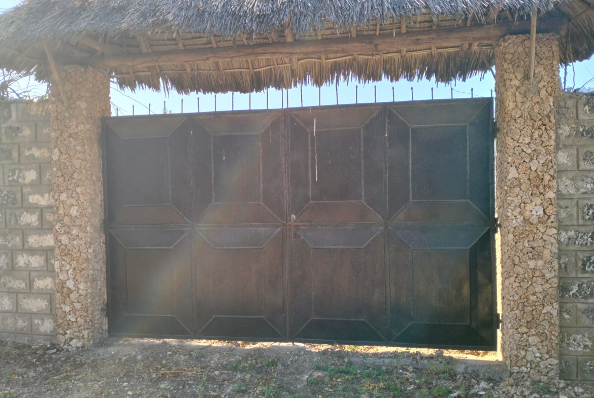 walled 0.5 acre plot for sale in Watamu