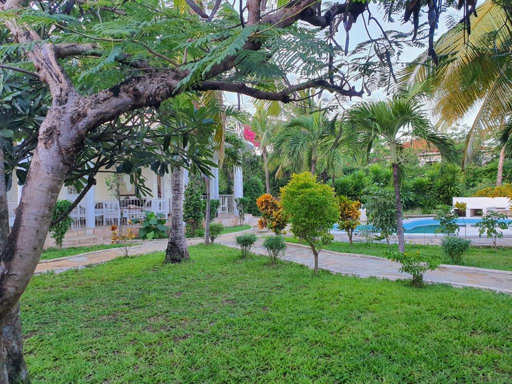 Elegant 4-Bedroom Villa for Sale on Casuarina Road garden view