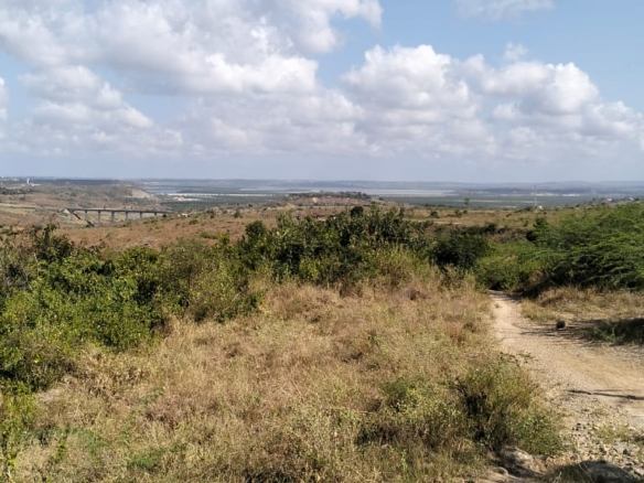 4.86 acres in Mazeras (Bonje), 1.2km off Mombasa Road. Solid rock, all-weather access, 3-phase power, panoramic Port Reitz views. Asking KSh 30.2M. Contact Mkaazi.