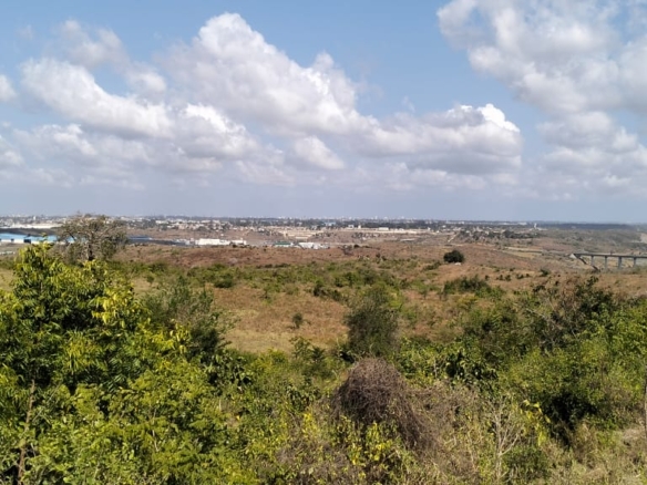 4.86 acres in Mazeras (Bonje), 1.2km off Mombasa Road. Solid rock, all-weather access, 3-phase power, panoramic Port Reitz views. Asking KSh 30.2M. Contact Mkaazi.