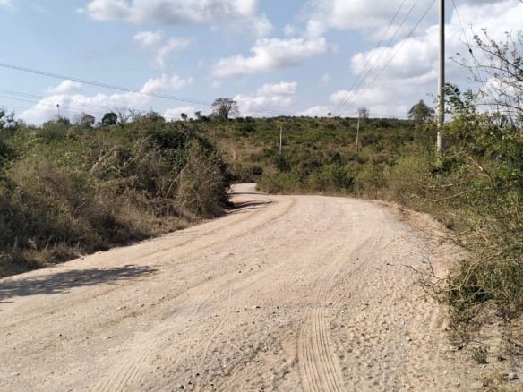 4.86 acres in Mazeras (Bonje), 1.2km off Mombasa Road. Solid rock, all-weather access, 3-phase power, panoramic Port Reitz views. Asking KSh 30.2M. Contact Mkaazi.