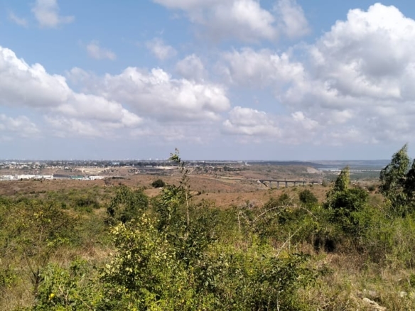 4.86 acres in Mazeras (Bonje), 1.2km off Mombasa Road. Solid rock, all-weather access, 3-phase power, panoramic Port Reitz views. Asking KSh 30.2M. Contact Mkaazi.