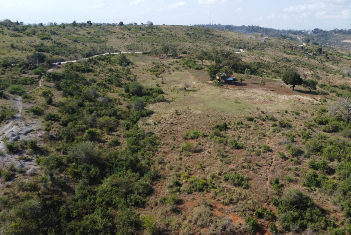 4.86 acres in Mazeras (Bonje), 1.2km off Mombasa Road. Solid rock, all-weather access, 3-phase power, panoramic Port Reitz views. Asking KSh 30.2M. Contact Mkaazi.
