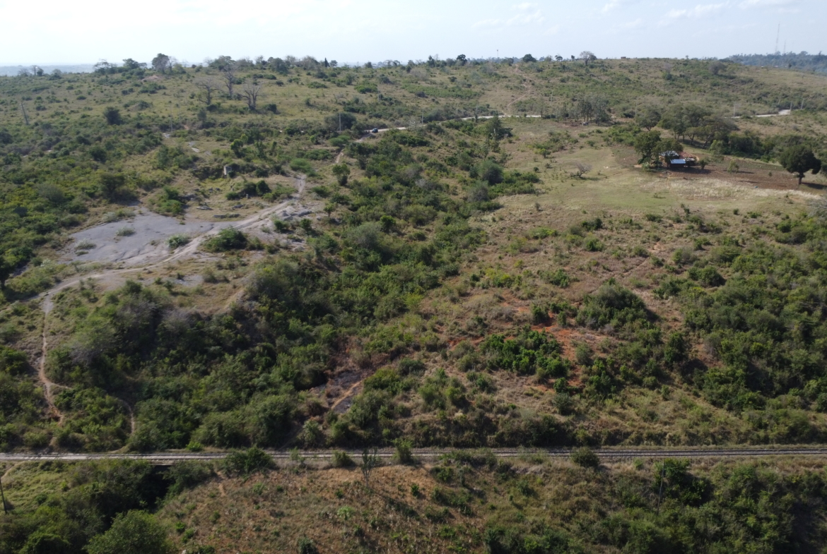 4.86 acres in Mazeras (Bonje), 1.2km off Mombasa Road. Solid rock, all-weather access, 3-phase power, panoramic Port Reitz views. Asking KSh 30.2M. Contact Mkaazi.
