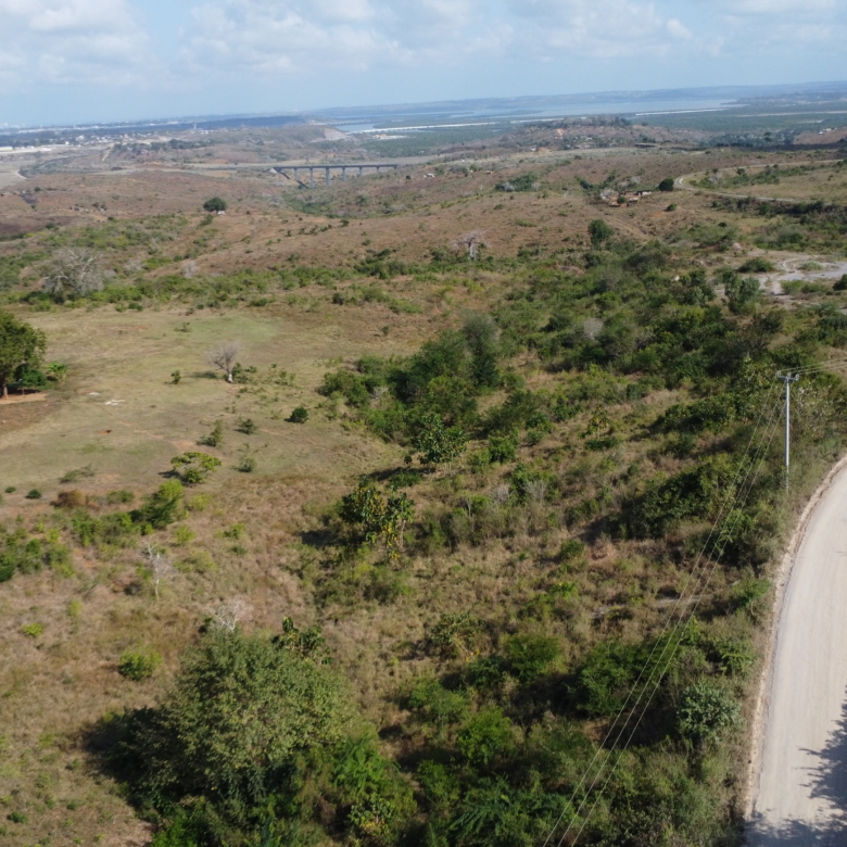 4.86 acres in Mazeras (Bonje), 1.2km off Mombasa Road. Solid rock, all-weather access, 3-phase power, panoramic Port Reitz views. Asking KSh 30.2M. Contact Mkaazi.