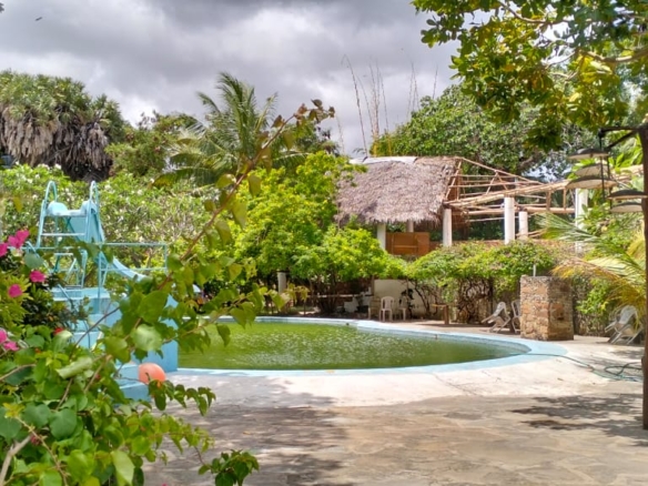 Boutique resort for sale Kenya, coastal property investment, resort with pool Kenya, freehold title property, apartments for sale [Insert Location], hospitality investment Kenya, resort for renovation Kenya