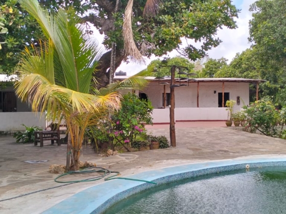 Boutique resort for sale Kenya, coastal property investment, resort with pool Kenya, freehold title property, apartments for sale [Insert Location], hospitality investment Kenya, resort for renovation Kenya