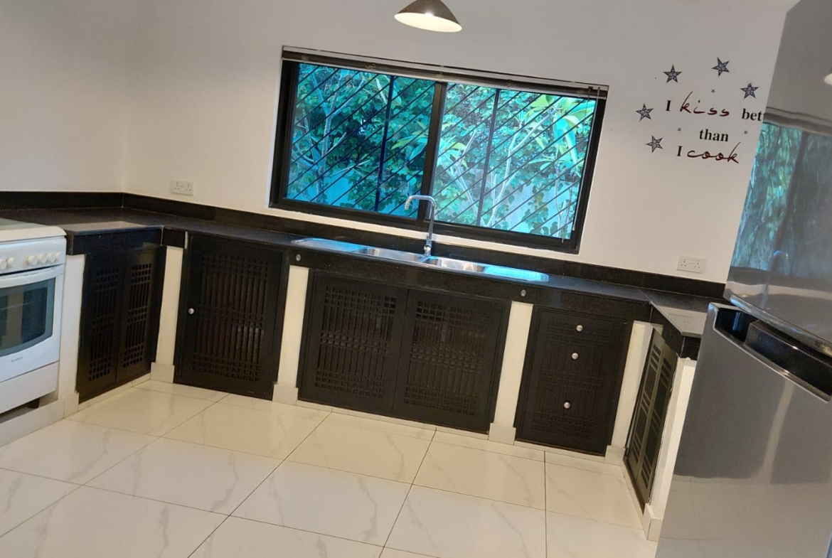 Luxury U-Shaped 4-Bedroom Home in Watamu | ½ Acre, Infinity Pool, 5-Car Garage & Private Garden – KES 42M