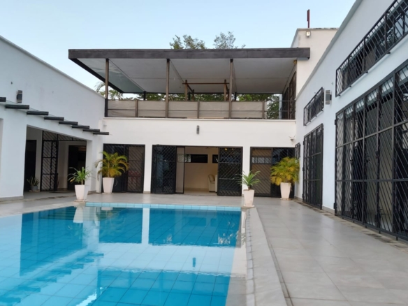 Luxury U-Shaped 4-Bedroom Home in Watamu | ½ Acre, Infinity Pool, 5-Car Garage & Private Garden – KES 42M