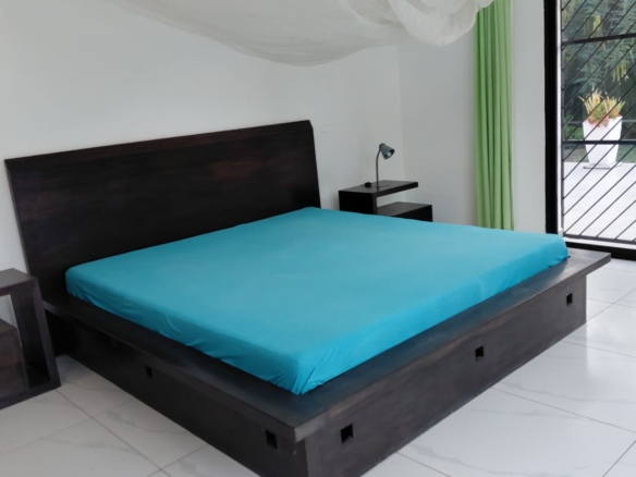 Luxury U-Shaped 4-Bedroom Home in Watamu | ½ Acre, Infinity Pool, 5-Car Garage & Private Garden – KES 42M