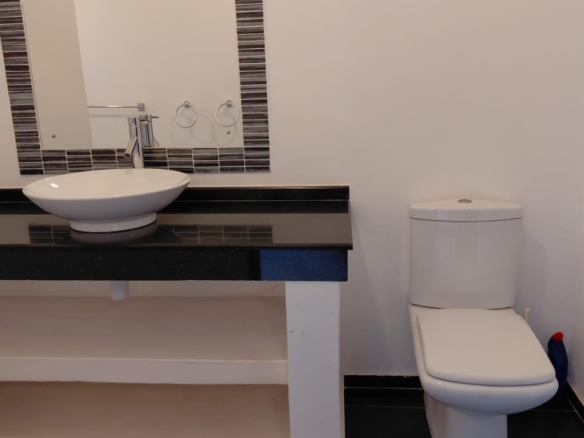 Luxury U-Shaped 4-Bedroom Home in Watamu | ½ Acre, Infinity Pool, 5-Car Garage & Private Garden – KES 42M