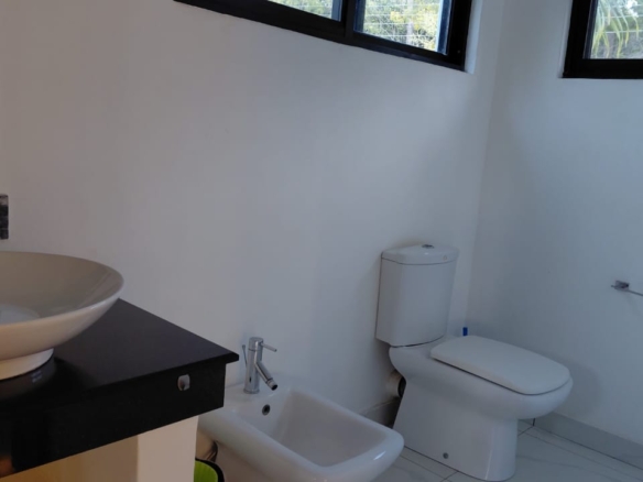 Luxury U-Shaped 4-Bedroom Home in Watamu | ½ Acre, Infinity Pool, 5-Car Garage & Private Garden – KES 42M