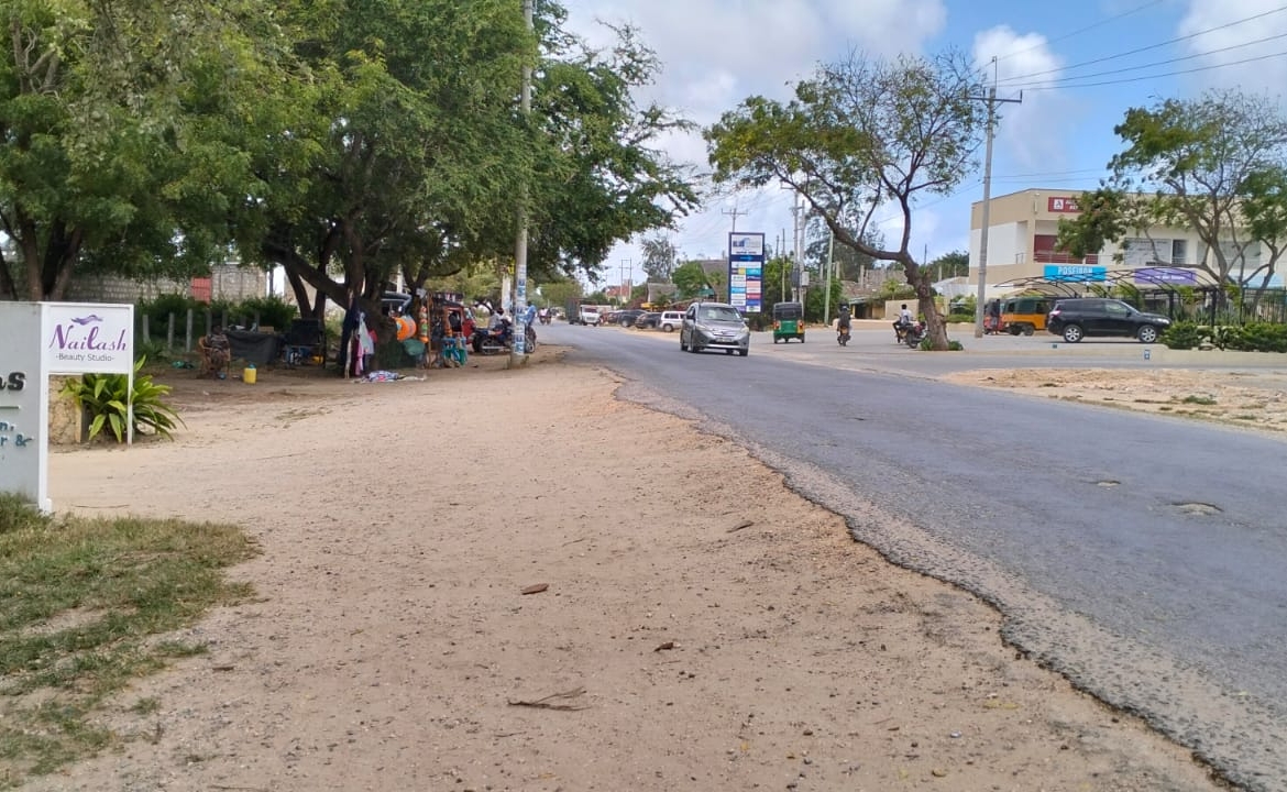 Prime half-acre plot for sale in Watamu, opposite Blue Moon Mall on Turtle Bay Road. Asking Ksh 25M. Clean title, mature trees, fenced, near Hemingway’s.