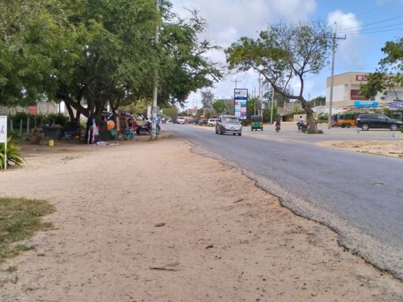 Prime half-acre plot for sale in Watamu, opposite Blue Moon Mall on Turtle Bay Road. Asking Ksh 25M. Clean title, mature trees, fenced, near Hemingway’s.