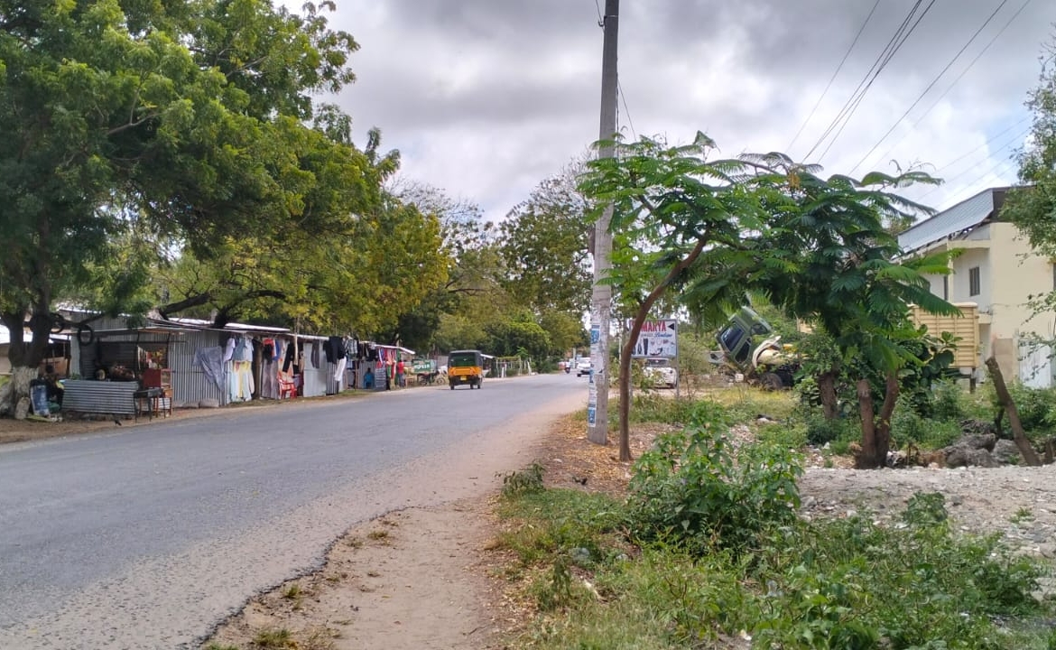 Prime half-acre plot for sale in Watamu, opposite Blue Moon Mall on Turtle Bay Road. Asking Ksh 25M. Clean title, mature trees, fenced, near Hemingway’s.