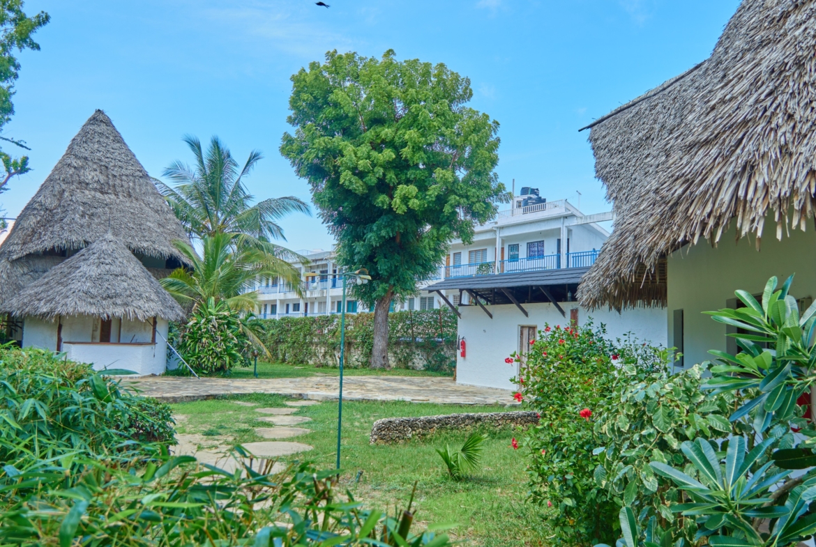 Fully furnished 2-bedroom duplex cottage for sale at Park Marine Villas, Silversands Road Malindi. Each floor has a bedroom. Steps to beach, 2 pools. €125,000.
