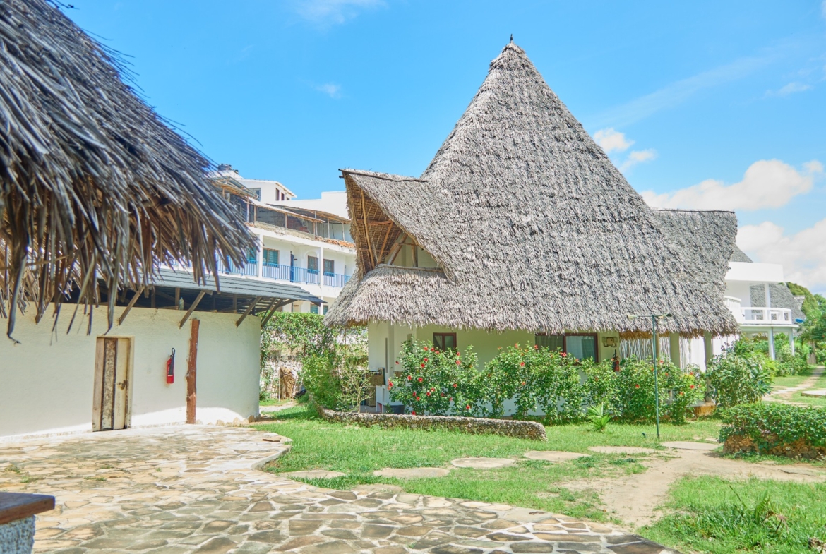 Fully furnished 2-bedroom duplex cottage for sale at Park Marine Villas, Silversands Road Malindi. Each floor has a bedroom. Steps to beach, 2 pools. €125,000.