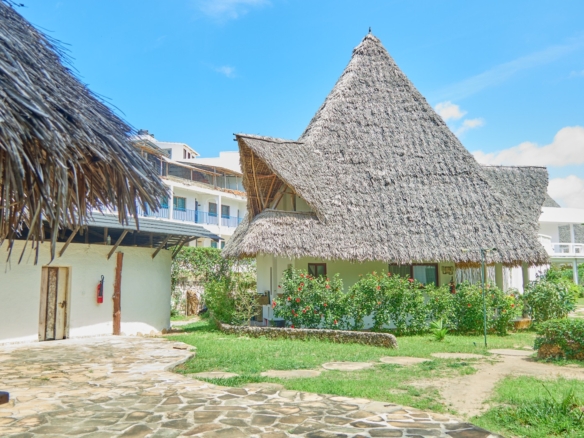 Fully furnished 2-bedroom duplex cottage for sale at Park Marine Villas, Silversands Road Malindi. Each floor has a bedroom. Steps to beach, 2 pools. €125,000.