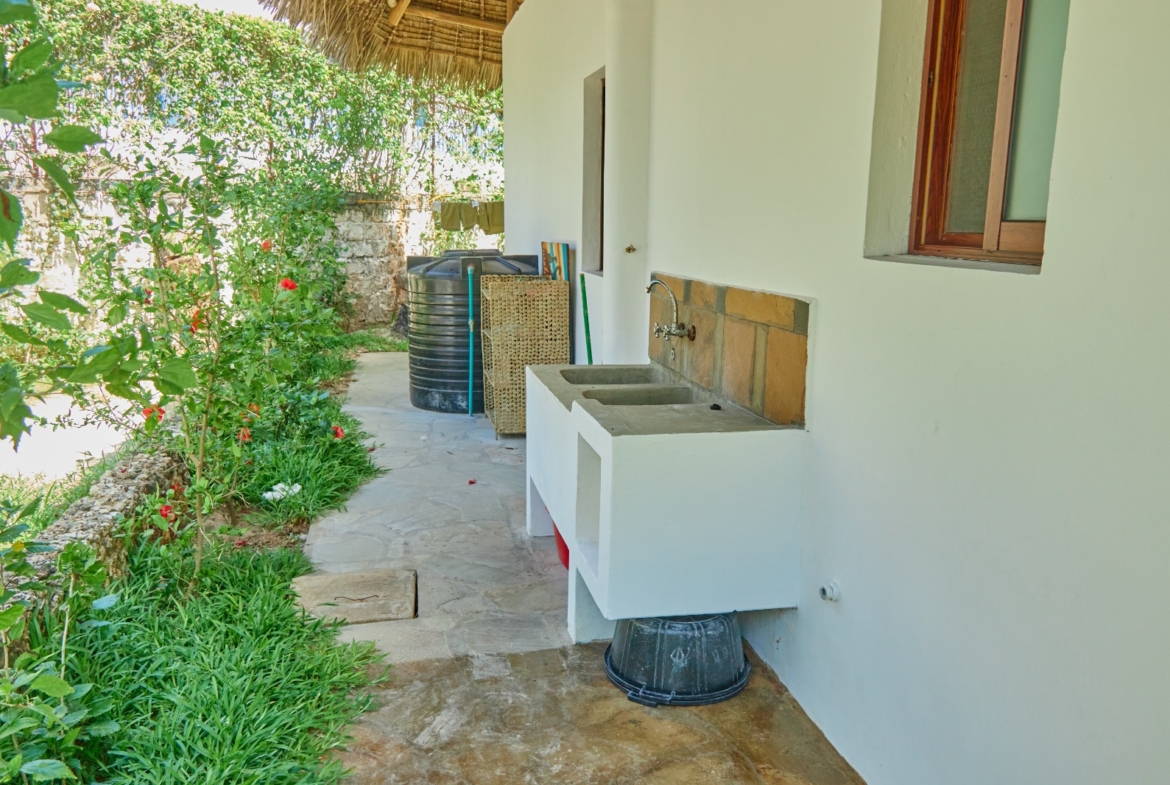 Fully furnished 2-bedroom duplex cottage for sale at Park Marine Villas, Silversands Road Malindi. Each floor has a bedroom. Steps to beach, 2 pools. €125,000.