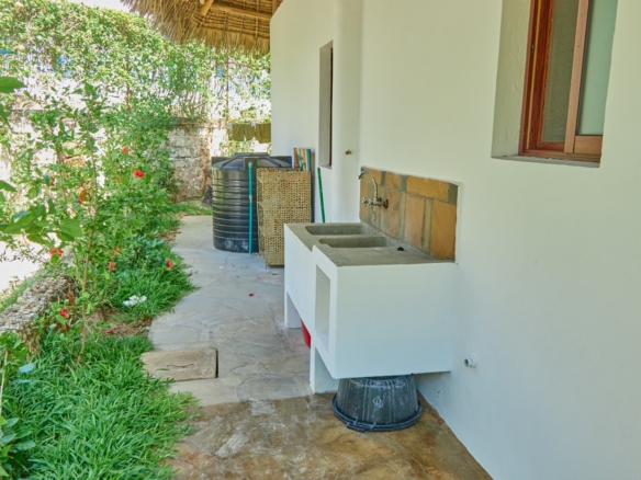 Fully furnished 2-bedroom duplex cottage for sale at Park Marine Villas, Silversands Road Malindi. Each floor has a bedroom. Steps to beach, 2 pools. €125,000.
