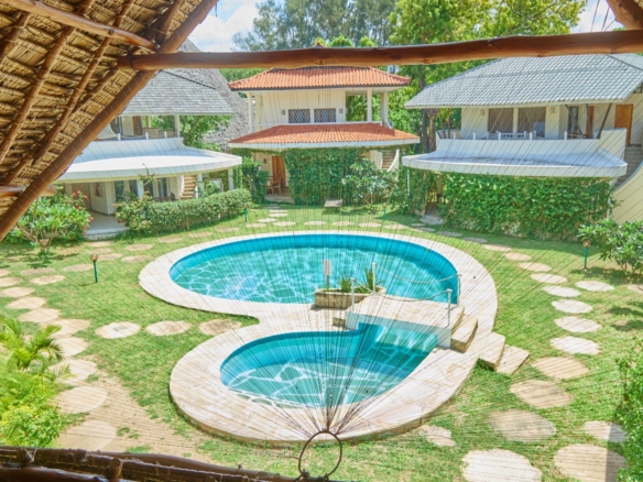 Fully furnished 2-bedroom duplex cottage for sale at Park Marine Villas, Silversands Road Malindi. Each floor has a bedroom. Steps to beach, 2 pools. €125,000.