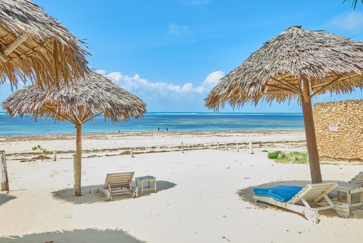 Fully furnished 2-bedroom duplex cottage for sale at Park Marine Villas, Silversands Road Malindi. Each floor has a bedroom. Steps to beach, 2 pools. €125,000.