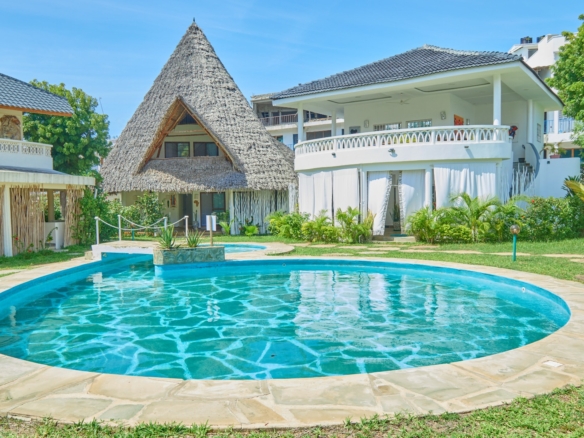 Fully furnished 2-bedroom duplex cottage for sale at Park Marine Villas, Silversands Road Malindi. Each floor has a bedroom. Steps to beach, 2 pools. €125,000.