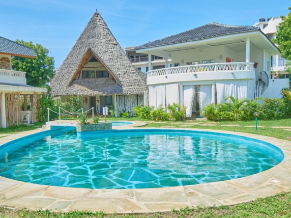 Fully furnished 2-bedroom duplex cottage for sale at Park Marine Villas, Silversands Road Malindi. Each floor has a bedroom. Steps to beach, 2 pools. €125,000.
