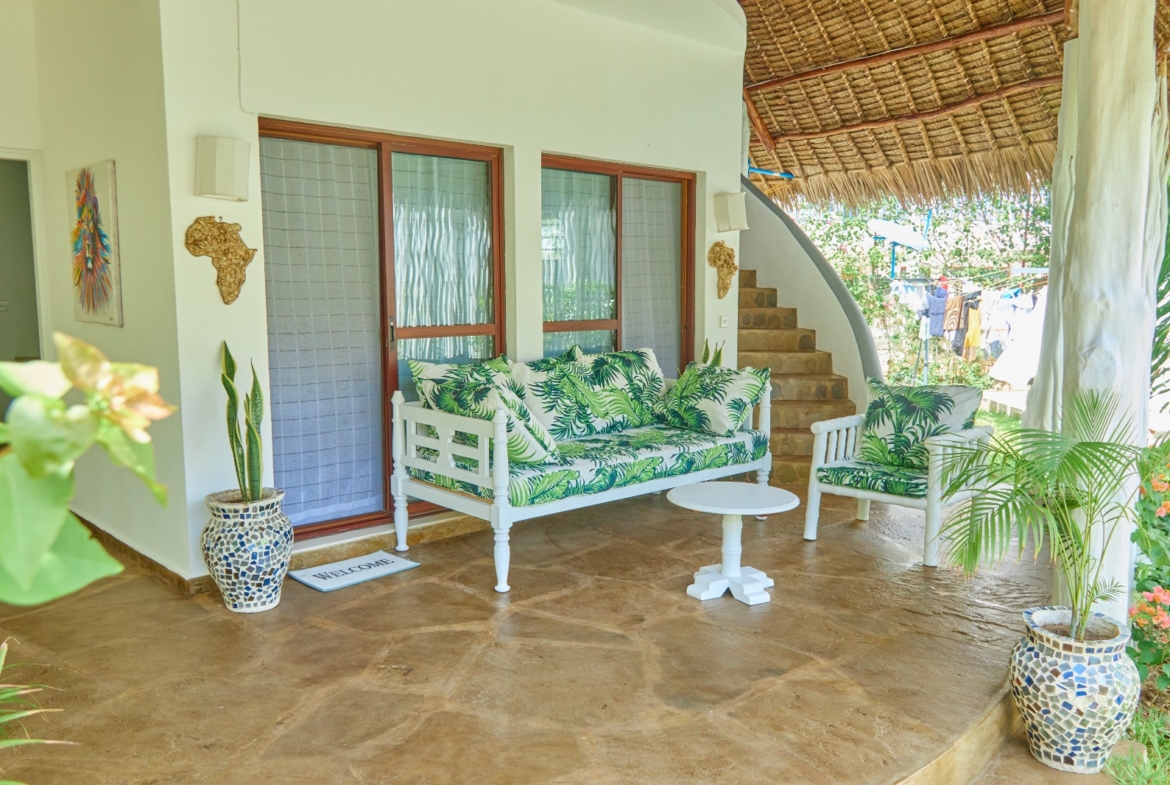 Fully furnished 2-bedroom duplex cottage for sale at Park Marine Villas, Silversands Road Malindi. Each floor has a bedroom. Steps to beach, 2 pools. €125,000.