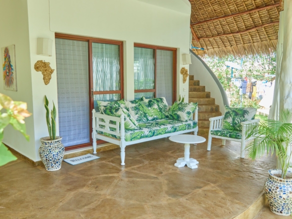 Fully furnished 2-bedroom duplex cottage for sale at Park Marine Villas, Silversands Road Malindi. Each floor has a bedroom. Steps to beach, 2 pools. €125,000.