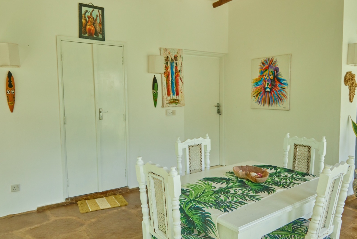 Fully furnished 2-bedroom duplex cottage for sale at Park Marine Villas, Silversands Road Malindi. Each floor has a bedroom. Steps to beach, 2 pools. €125,000.