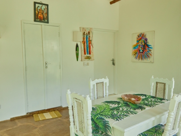 Fully furnished 2-bedroom duplex cottage for sale at Park Marine Villas, Silversands Road Malindi. Each floor has a bedroom. Steps to beach, 2 pools. €125,000.
