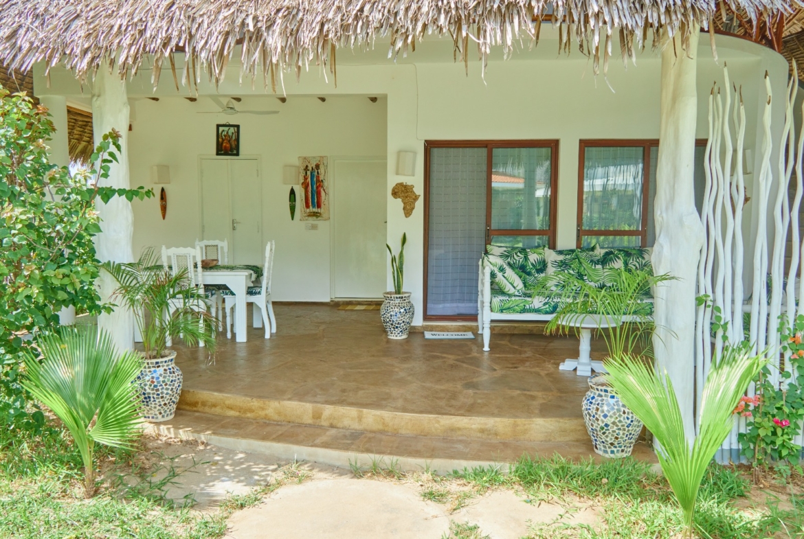 Fully furnished 2-bedroom duplex cottage for sale at Park Marine Villas, Silversands Road Malindi. Each floor has a bedroom. Steps to beach, 2 pools. €125,000.