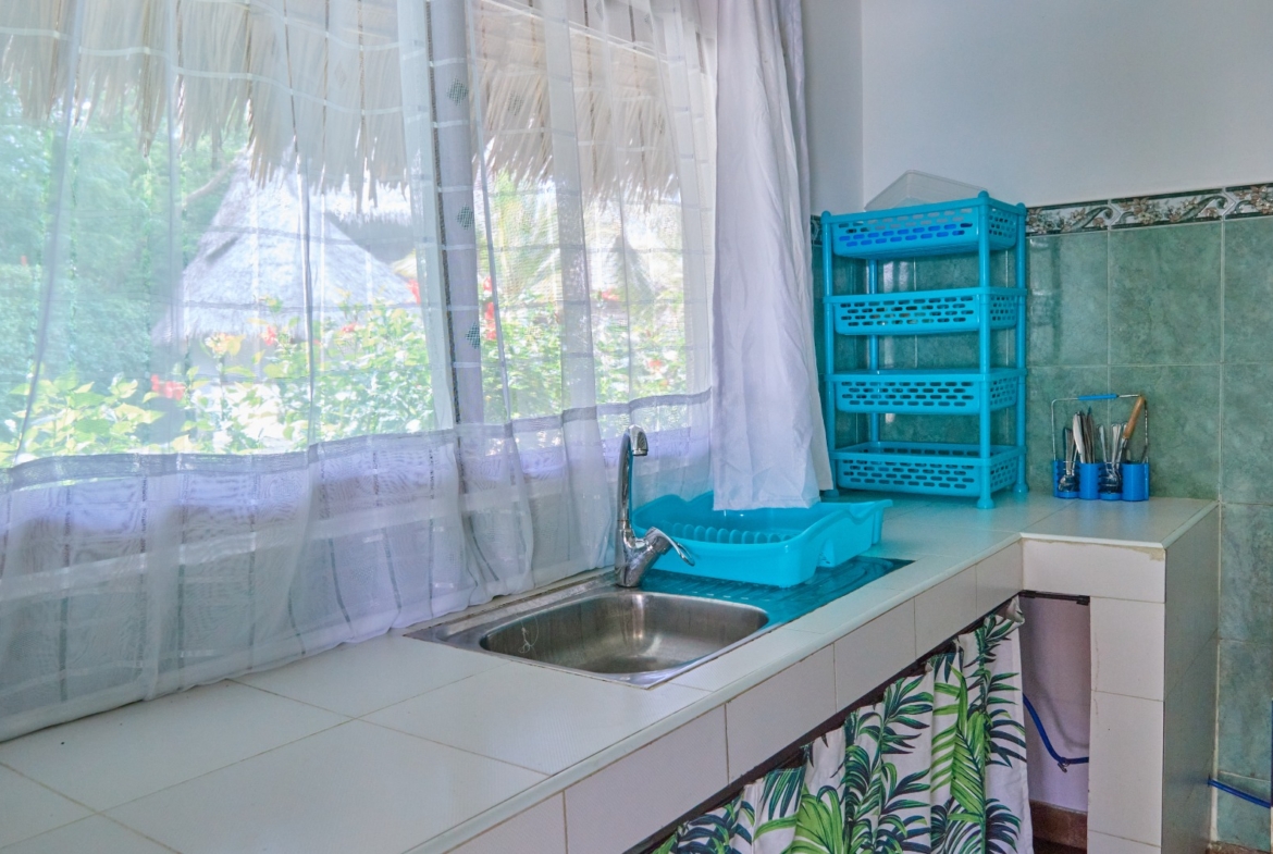 Fully furnished 2-bedroom duplex cottage for sale at Park Marine Villas, Silversands Road Malindi. Each floor has a bedroom. Steps to beach, 2 pools. €125,000.
