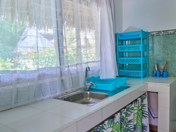 Fully furnished 2-bedroom duplex cottage for sale at Park Marine Villas, Silversands Road Malindi. Each floor has a bedroom. Steps to beach, 2 pools. €125,000.