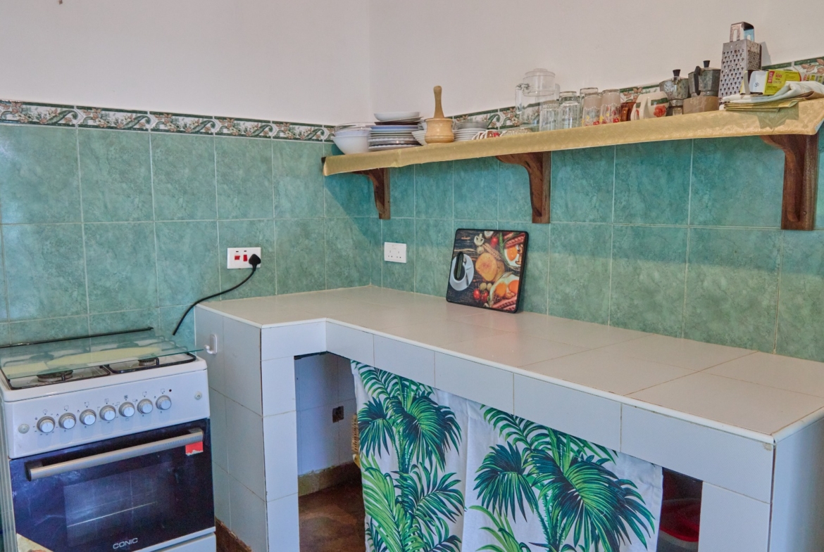 Fully furnished 2-bedroom duplex cottage for sale at Park Marine Villas, Silversands Road Malindi. Each floor has a bedroom. Steps to beach, 2 pools. €125,000.