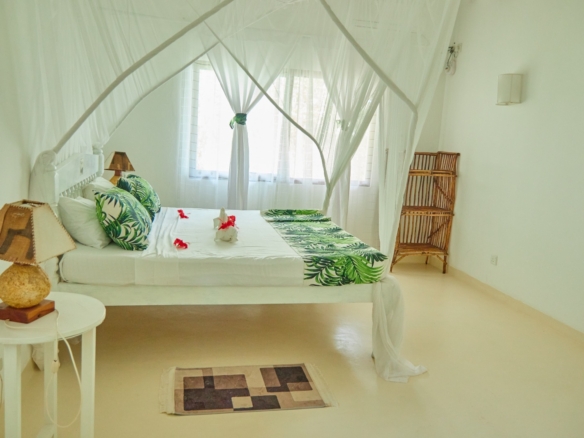 Fully furnished 2-bedroom duplex cottage for sale at Park Marine Villas, Silversands Road Malindi. Each floor has a bedroom. Steps to beach, 2 pools. €125,000.