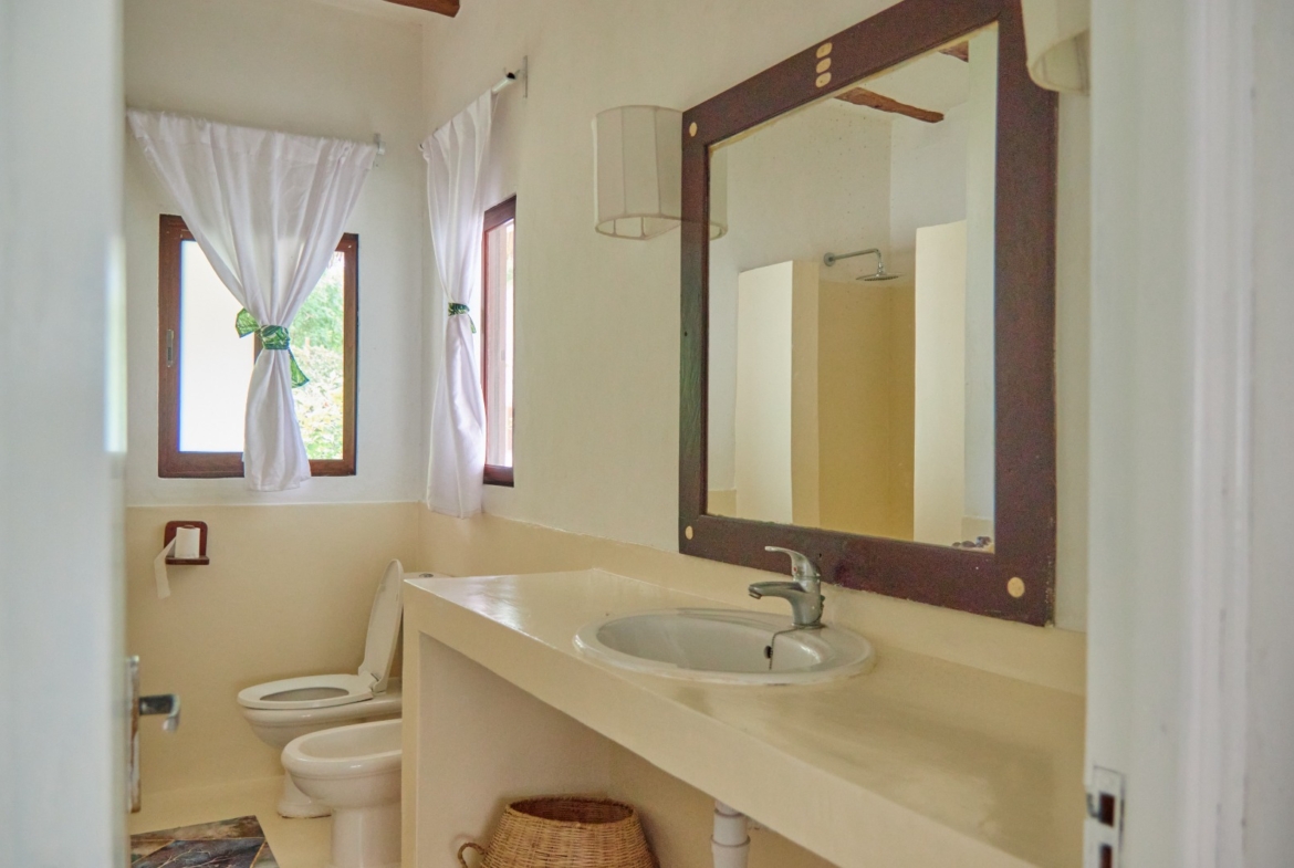 Fully furnished 2-bedroom duplex cottage for sale at Park Marine Villas, Silversands Road Malindi. Each floor has a bedroom. Steps to beach, 2 pools. €125,000.
