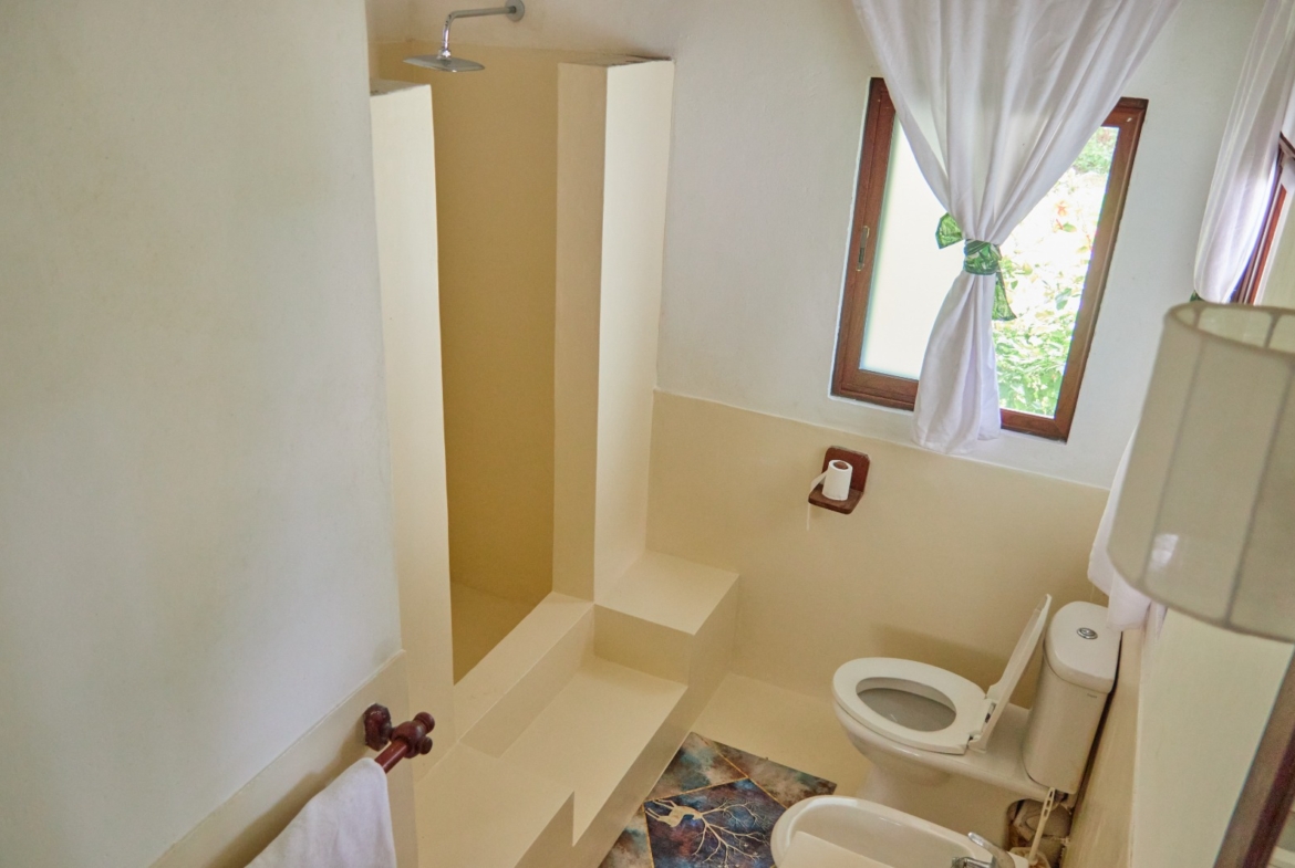 Fully furnished 2-bedroom duplex cottage for sale at Park Marine Villas, Silversands Road Malindi. Each floor has a bedroom. Steps to beach, 2 pools. €125,000.