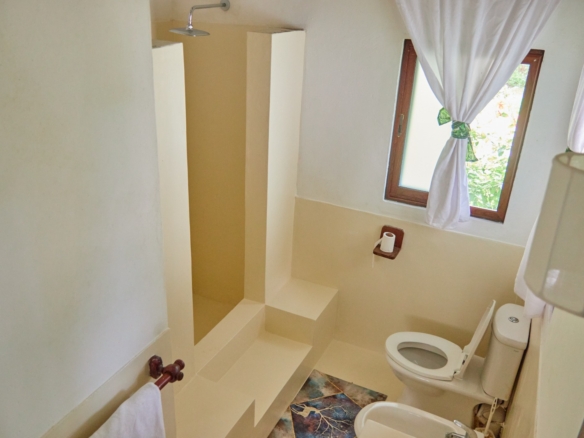 Fully furnished 2-bedroom duplex cottage for sale at Park Marine Villas, Silversands Road Malindi. Each floor has a bedroom. Steps to beach, 2 pools. €125,000.