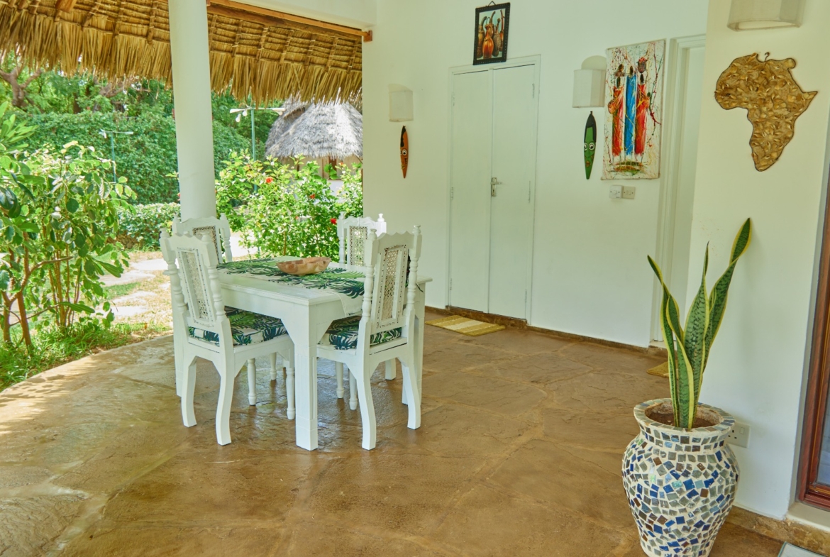 Fully furnished 2-bedroom duplex cottage for sale at Park Marine Villas, Silversands Road Malindi. Each floor has a bedroom. Steps to beach, 2 pools. €125,000.