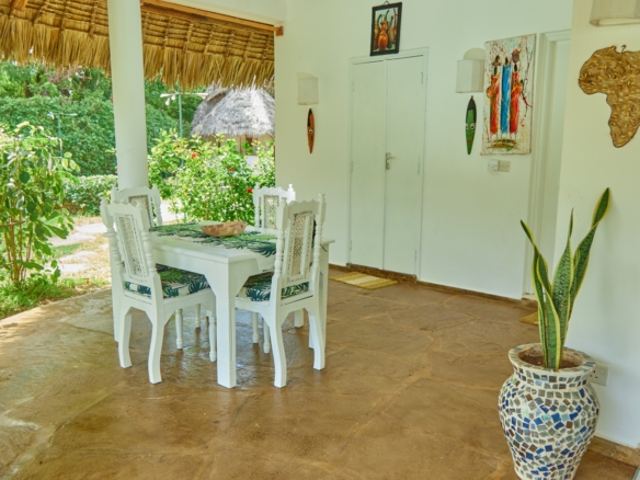 Fully furnished 2-bedroom duplex cottage for sale at Park Marine Villas, Silversands Road Malindi. Each floor has a bedroom. Steps to beach, 2 pools. €125,000.
