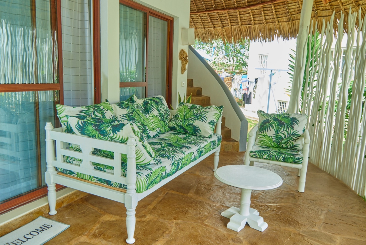Fully furnished 2-bedroom duplex cottage for sale at Park Marine Villas, Silversands Road Malindi. Each floor has a bedroom. Steps to beach, 2 pools. €125,000.