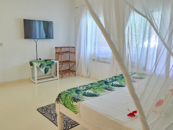 Fully furnished 2-bedroom duplex cottage for sale at Park Marine Villas, Silversands Road Malindi. Each floor has a bedroom. Steps to beach, 2 pools. €125,000.