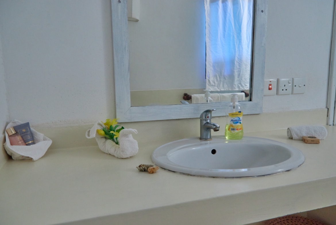Fully furnished 2-bedroom duplex cottage for sale at Park Marine Villas, Silversands Road Malindi. Each floor has a bedroom. Steps to beach, 2 pools. €125,000.