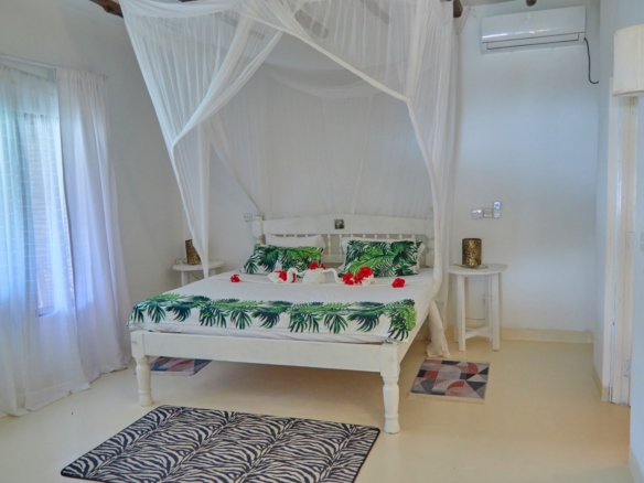 Fully furnished 2-bedroom duplex cottage for sale at Park Marine Villas, Silversands Road Malindi. Each floor has a bedroom. Steps to beach, 2 pools. €125,000.