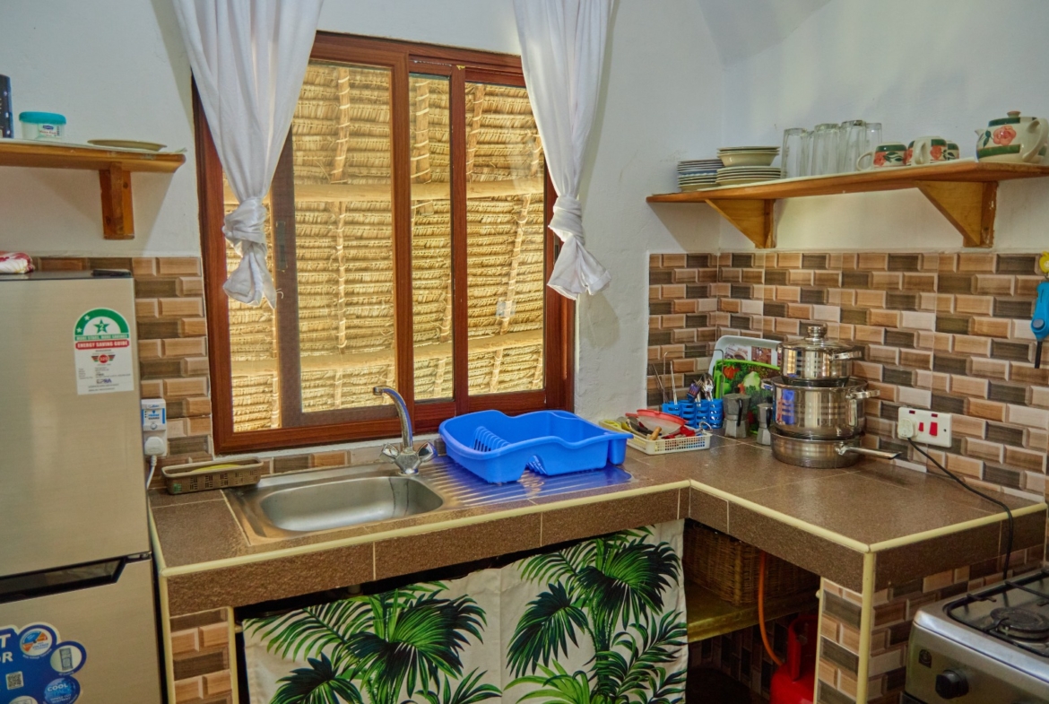 Fully furnished 2-bedroom duplex cottage for sale at Park Marine Villas, Silversands Road Malindi. Each floor has a bedroom. Steps to beach, 2 pools. €125,000.